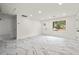 Bright and airy living area with marble floors and a large window at 641 Hamilton E Holmes Nw Dr, Atlanta, GA 30318