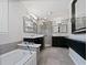 Luxurious primary bathroom with double vanities, a glass-enclosed shower, and a separate soaking tub at 3549 Meadow Chase Dr, Marietta, GA 30062