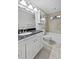 Bright bathroom featuring tile floors, granite vanity, and a shower-tub combination at 3549 Meadow Chase Dr, Marietta, GA 30062