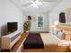 Bedroom with wooden floors, a bed, dresser and view of the backyard at 3549 Meadow Chase Dr, Marietta, GA 30062