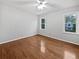 Neutral bedroom features gleaming hardwood floors, a ceiling fan, and lots of natural light at 3549 Meadow Chase Dr, Marietta, GA 30062
