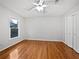Bright bedroom features hardwood floors, a ceiling fan, and a large closet for ample storage at 3549 Meadow Chase Dr, Marietta, GA 30062