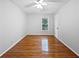 An empty bedroom features wood floors, a window and a door to a closet at 3549 Meadow Chase Dr, Marietta, GA 30062
