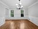 Elegant dining room with hardwood floors, decorative moldings, and a modern chandelier at 3549 Meadow Chase Dr, Marietta, GA 30062