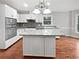 Open kitchen with granite countertops, stainless appliances, and center island at 3549 Meadow Chase Dr, Marietta, GA 30062