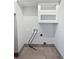 Functional laundry room with tile floors and upper cabinet, ready for appliances to be installed at 3549 Meadow Chase Dr, Marietta, GA 30062