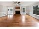 Spacious living room featuring hardwood floors and a brick fireplace at 3549 Meadow Chase Dr, Marietta, GA 30062