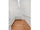 Spacious walk-in closet with custom shelves and hardwood floors provides ample storage at 3549 Meadow Chase Dr, Marietta, GA 30062