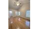 Bright bedroom with hardwood floors and double closets at 1845 Mckendree Lake Dr, Lawrenceville, GA 30043