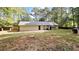 Spacious backyard featuring a concrete patio and surrounded by a wooden fence for privacy at 115 Bond Dr, Ellenwood, GA 30294