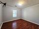 Bedroom with hardwood floors and natural light from a window at 115 Bond Dr, Ellenwood, GA 30294