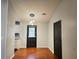 Dining room with modern lighting and access to the kitchen and door to outside at 115 Bond Dr, Ellenwood, GA 30294