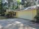 Spacious two-car garage with a concrete driveway and manicured lawn at 115 Bond Dr, Ellenwood, GA 30294