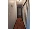 Hallway with hardwood floors and closet doors at 115 Bond Dr, Ellenwood, GA 30294