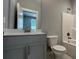 Modern bathroom with a tub and gray vanity at 700 Banton Nw Dr, Atlanta, GA 30318