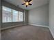 Spacious bedroom with ceiling fan and large window at 700 Banton Nw Dr, Atlanta, GA 30318