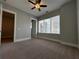Bright bedroom with ceiling fan and large window at 700 Banton Nw Dr, Atlanta, GA 30318