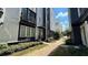 Modern townhouses with landscaped grounds and a shared walkway at 700 Banton Nw Dr, Atlanta, GA 30318