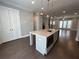 Kitchen island with granite countertop and stainless steel appliances at 700 Banton Nw Dr, Atlanta, GA 30318