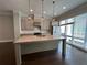 Modern kitchen with an island, stainless steel appliances, and granite countertops at 700 Banton Nw Dr, Atlanta, GA 30318