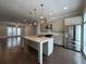 Open concept kitchen with island, stainless steel appliances, and granite countertops at 700 Banton Nw Dr, Atlanta, GA 30318