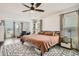 Spacious bedroom with ceiling fan, stylish rug, and plenty of natural light at 640 Avondale Park Cir, Decatur, GA 30032