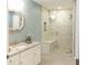 Bathroom featuring a tile shower with a glass door and a vanity with granite countertop at 86 Waterford Path, Hiram, GA 30141