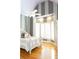 Stylish bedroom features vaulted ceiling, striped accent walls, and hardwood floors at 86 Waterford Path, Hiram, GA 30141