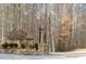 Community entrance featuring stonework, landscaping, and signage at 86 Waterford Path, Hiram, GA 30141