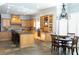 Spacious kitchen featuring wooden cabinets, granite countertops, tile backsplash, and a breakfast nook at 86 Waterford Path, Hiram, GA 30141