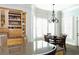 Bright kitchen with a wood table and dining area located next to a granite kitchen island at 86 Waterford Path, Hiram, GA 30141