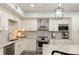 Modern kitchen with stainless steel appliances and granite countertops at 86 Waterford Path, Hiram, GA 30141