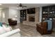 Cozy living room with a brick fireplace and built-in bookshelves at 86 Waterford Path, Hiram, GA 30141