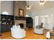 Spacious living room featuring a brick fireplace, built-in shelving, and vaulted ceiling at 86 Waterford Path, Hiram, GA 30141