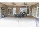 Expansive outdoor patio with brick and wood accents and ample space for dining and entertaining at 86 Waterford Path, Hiram, GA 30141
