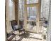 Relaxing screened porch with brick flooring, comfortable seating, and backyard views at 86 Waterford Path, Hiram, GA 30141
