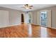 Spacious bedroom with hardwood floors, neutral paint, and large windows with shutters at 3649 Peachtree Ne Rd # 201, Atlanta, GA 30319