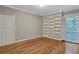 Bedroom featuring built-in bookshelves, neutral paint, and natural lighting at 3649 Peachtree Ne Rd # 201, Atlanta, GA 30319