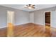 Spacious bedroom featuring hardwood floors, neutral paint, and access to the bathroom at 3649 Peachtree Ne Rd # 201, Atlanta, GA 30319