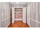 Hallway featuring spacious closet with shelving and wood parquet flooring at 3649 Peachtree Ne Rd # 201, Atlanta, GA 30319