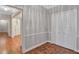 Hallway with detailed parquet floors and wall trim, next to spacious closet at 3649 Peachtree Ne Rd # 201, Atlanta, GA 30319