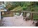 Back deck with outdoor seating and view of the trees at 6914 Fairway Trl, Austell, GA 30168