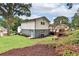 Landscaped backyard and deck behind house at 6914 Fairway Trl, Austell, GA 30168