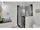 Modern bathroom featuring a sleek glass shower with black trim and a stylish vessel sink at 6914 Fairway Trl, Austell, GA 30168