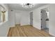 Bright, modern bedroom with hardwood floors, white walls and access to an ensuite bathroom at 6914 Fairway Trl, Austell, GA 30168
