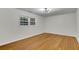 Bright bedroom with hardwood floors and ample natural light at 6914 Fairway Trl, Austell, GA 30168