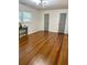 Bedroom with hardwood floors and modern light fixture at 6914 Fairway Trl, Austell, GA 30168