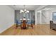Dining room with modern lighting and hardwood floors at 6914 Fairway Trl, Austell, GA 30168