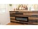 Modern fireplace with a rustic wood accent wall at 6914 Fairway Trl, Austell, GA 30168