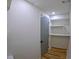 Entryway with door, wood floors and a closet with three tiers of shelving at 6914 Fairway Trl, Austell, GA 30168